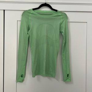 Lululemon swiftly tech (likely first version, good quality). Size 4.